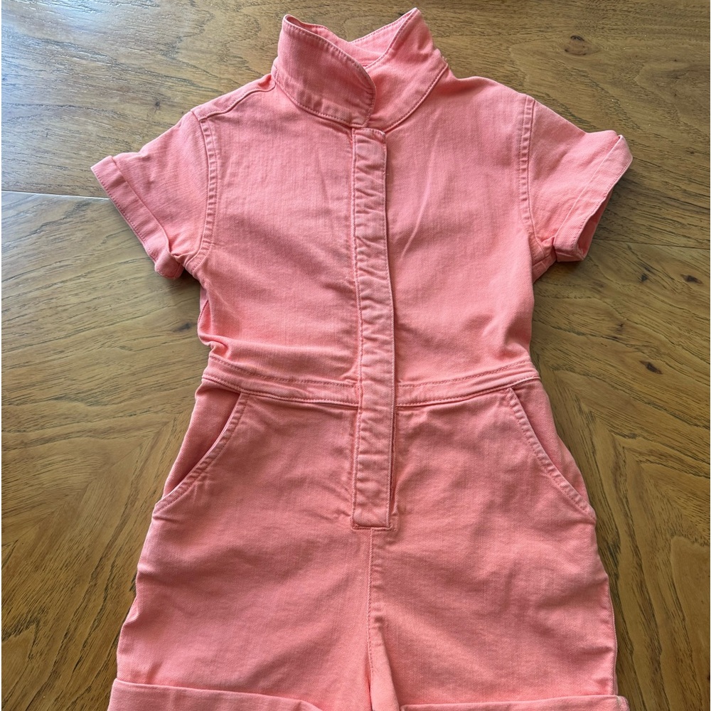 Size 8-9Y Mini Boden, Pink, denim snap front romper with heart patch pockets.